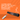 Wireless remote with Bluetooth speaker control on an orange background